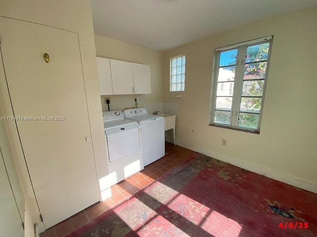 1722 Jefferson Ave, Miami Beach, FL 33139 - clothes washing area with washing machine and clothes dryer, baseboards, tile patterned flooring, and cabinet space