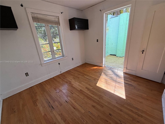1722 Jefferson Ave, Miami Beach, FL 33139 - spare room with baseboards and wood finished floors