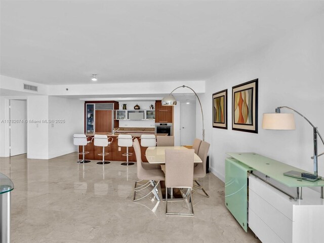 17201 Collins Ave Unit 704, Sunny Isles Beach, FL 33160 - dining room with marble finish floor and visible vents