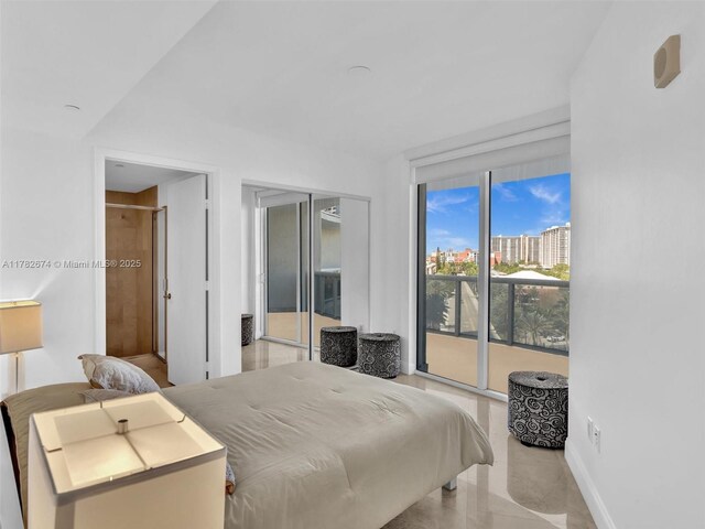 17201 Collins Ave Unit 704, Sunny Isles Beach, FL 33160 - bedroom featuring baseboards, tile patterned floors, and access to exterior