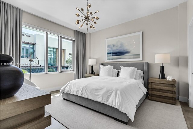 650 NE 32nd St Unit Bh6, Miami, FL 33137 - bedroom with a chandelier and baseboards