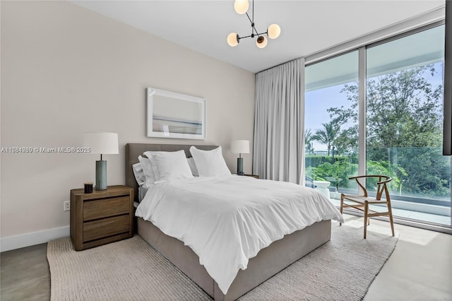 650 NE 32nd St Unit Bh6, Miami, FL 33137 - bedroom featuring concrete floors and a chandelier