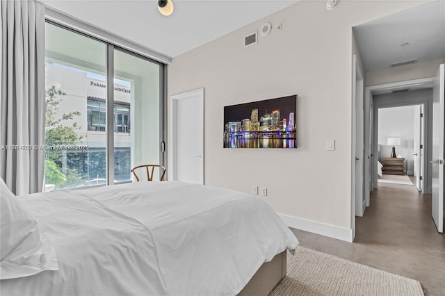 650 NE 32nd St Unit Bh6, Miami, FL 33137 - bedroom with finished concrete flooring and floor to ceiling windows
