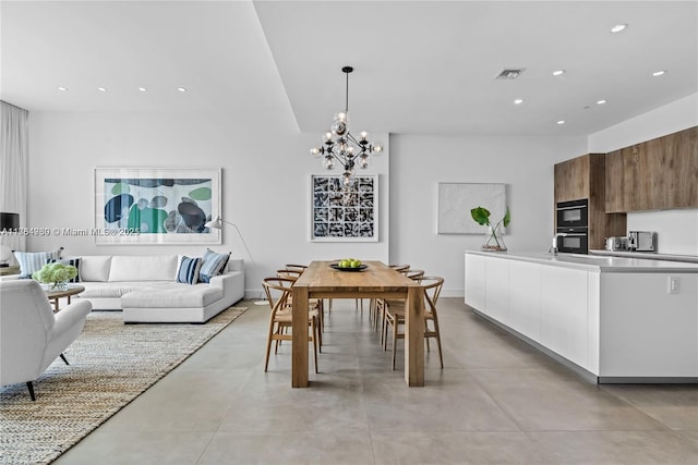 650 NE 32nd St Unit Bh6, Miami, FL 33137 - dining space with recessed lighting, a chandelier, and concrete floors