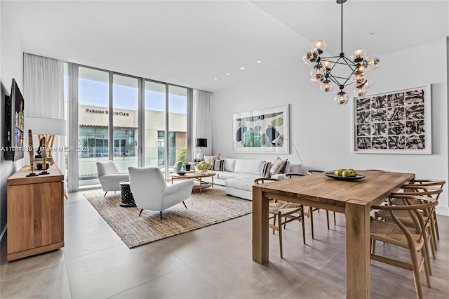 650 NE 32nd St Unit Bh6, Miami, FL 33137 - dining area featuring a wall of windows, a chandelier, finished concrete flooring, and a high ceiling