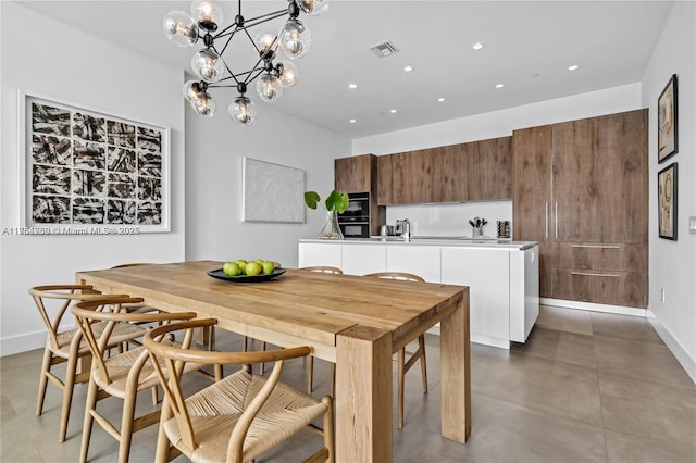 650 NE 32nd St Unit Bh6, Miami, FL 33137 - dining area with recessed lighting, finished concrete floors, and a chandelier