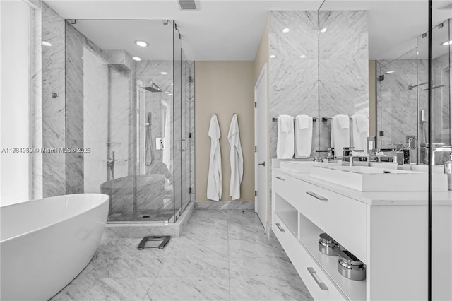 650 NE 32nd St Unit Bh6, Miami, FL 33137 - bathroom featuring a freestanding bath, vanity, a marble finish shower, recessed lighting, and marble finish flooring