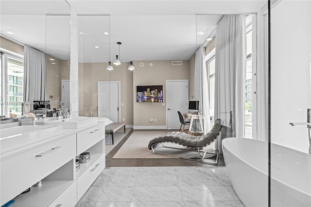 650 NE 32nd St Unit Bh6, Miami, FL 33137 - full bath featuring vanity, a freestanding bath, marble finish floors, and recessed lighting