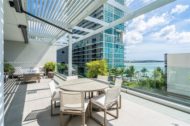 650 NE 32nd St Unit Bh6, Miami, FL 33137 - view of patio with a water view, a pergola, and outdoor dining space