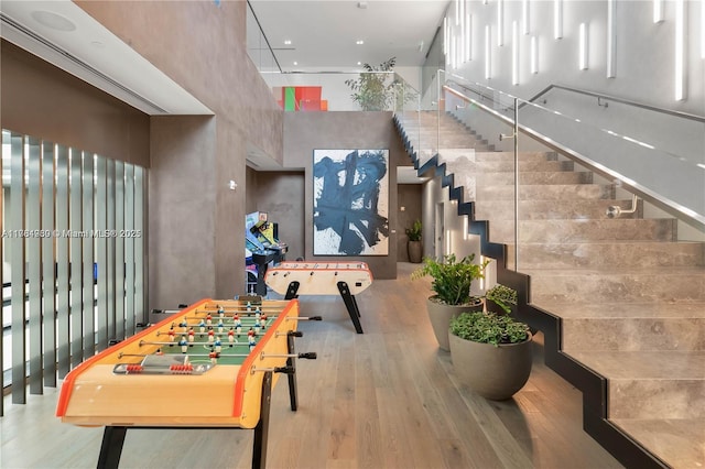 650 NE 32nd St Unit Bh6, Miami, FL 33137 - rec room with a high ceiling and wood finished floors