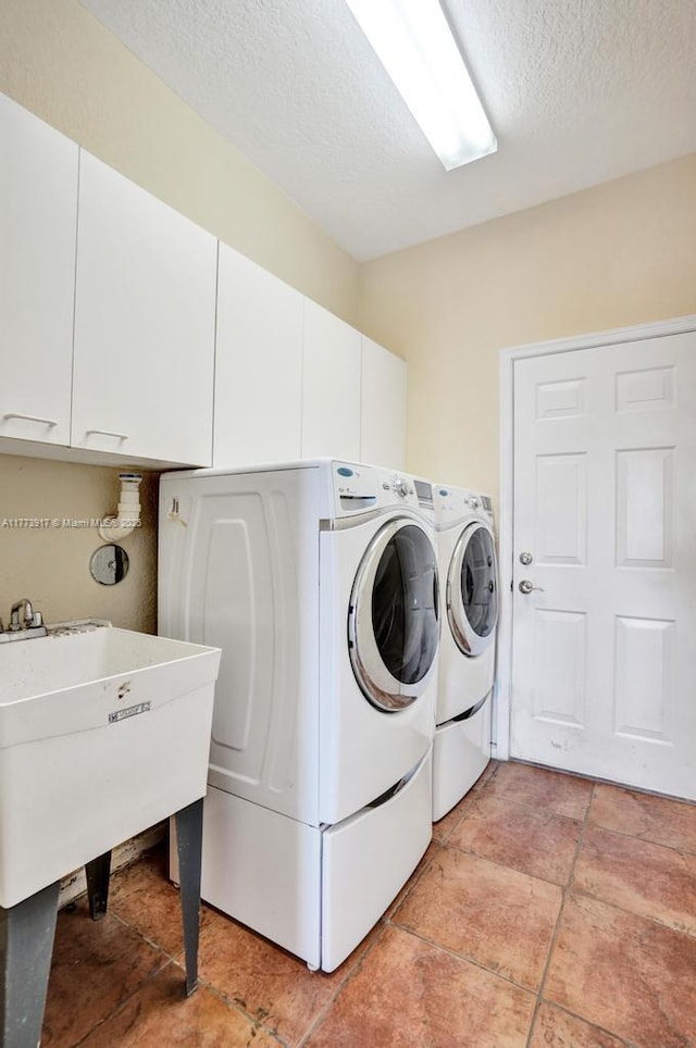 16519 SW 54th Ct, Miramar, FL 33027 - washroom with cabinet space, washing machine and dryer, and a textured ceiling