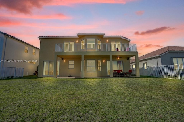 16519 SW 54th Ct, Miramar, FL 33027 - back of property featuring a balcony, stucco siding, a fenced backyard, a patio area, and a ceiling fan