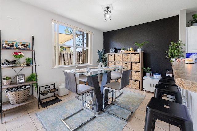 1074 NE 41st Pl, Homestead, FL 33033 - dining space featuring light tile patterned flooring and an accent wall