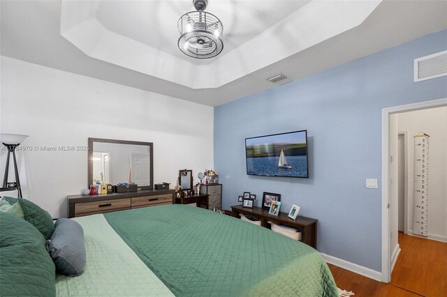 1074 NE 41st Pl, Homestead, FL 33033 - bedroom featuring wood finished floors and a raised ceiling