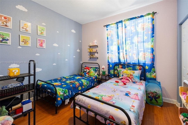 1074 NE 41st Pl, Homestead, FL 33033 - bedroom featuring wood finished floors and baseboards