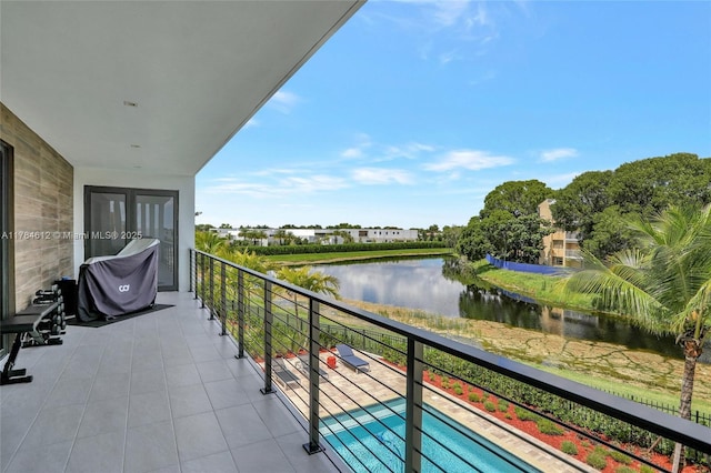 balcony featuring a water view