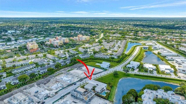 birds eye view of property featuring a water view