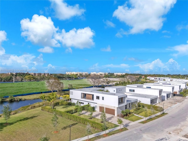 birds eye view of property with a water view