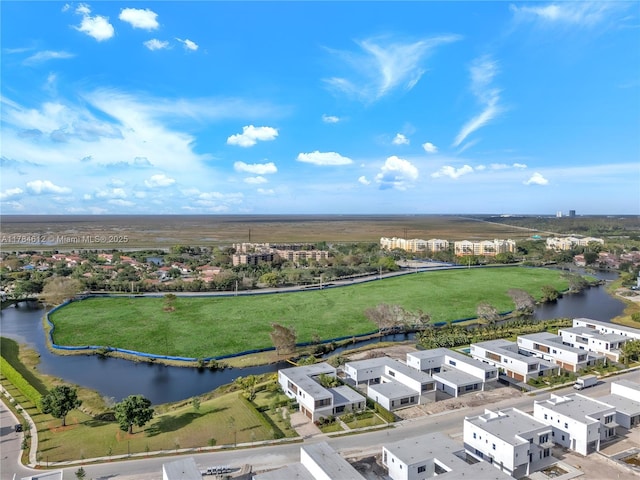 birds eye view of property with a water view and a residential view