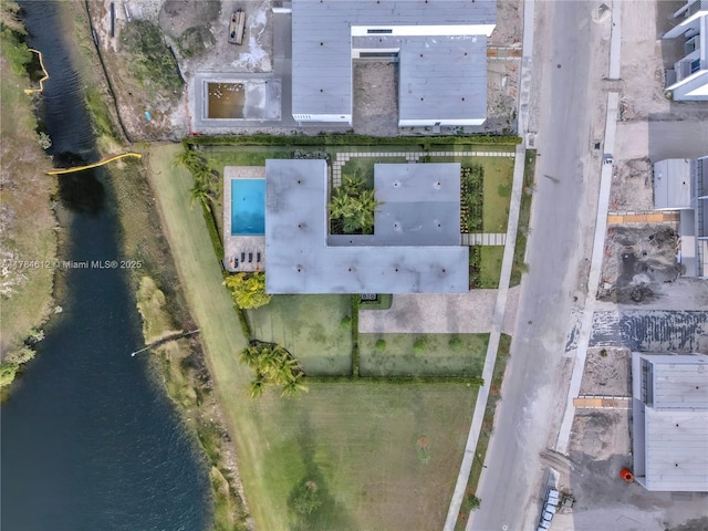 drone / aerial view with a water view