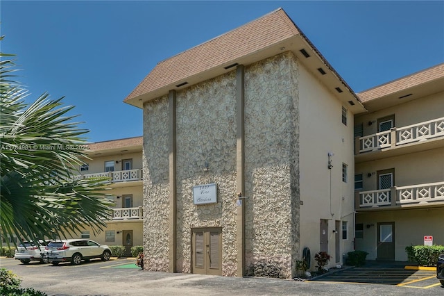 view of property with uncovered parking