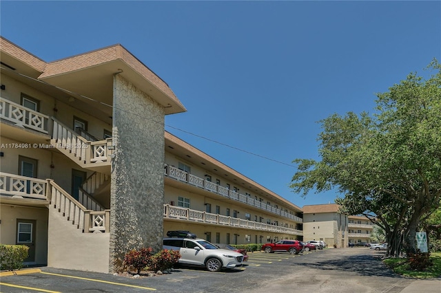view of property with uncovered parking