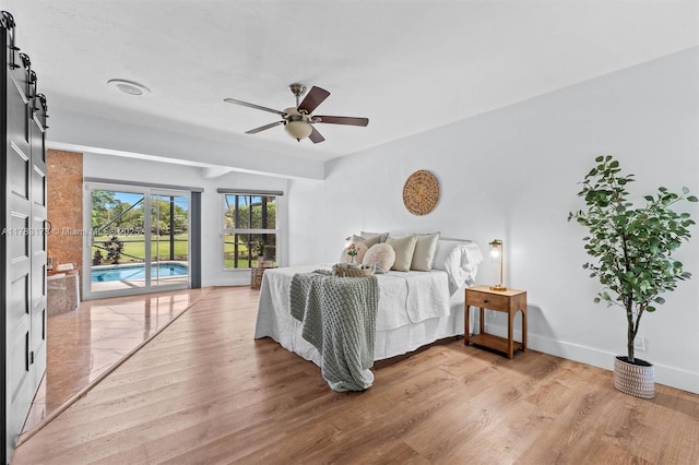 5721 Bayberry Ln, Tamarac, FL 33319 - bedroom with access to exterior, light wood-style flooring, and a ceiling fan