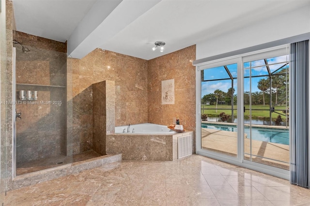 5721 Bayberry Ln, Tamarac, FL 33319 - bathroom featuring a bath and tiled shower