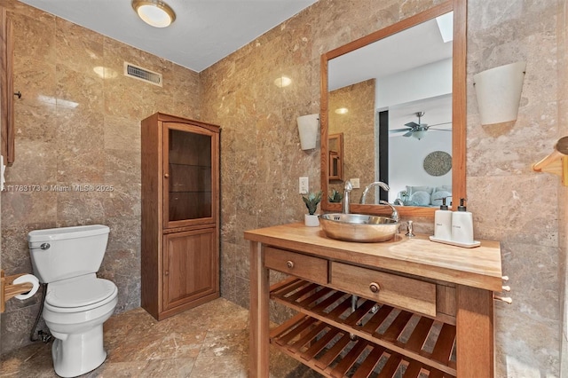 5721 Bayberry Ln, Tamarac, FL 33319 - bathroom featuring tile walls, vanity, and a ceiling fan