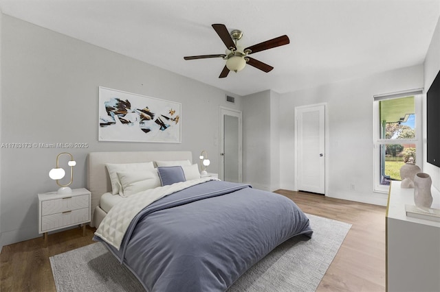 5721 Bayberry Ln, Tamarac, FL 33319 - bedroom with wood finished floors and a ceiling fan