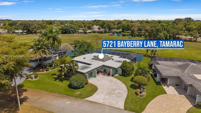 5721 Bayberry Ln, Tamarac, FL 33319 - view of subject property with a large body of water and a tree filled landscape