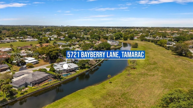 5721 Bayberry Ln, Tamarac, FL 33319 - aerial perspective of suburban area with a large body of water and a tree filled landscape