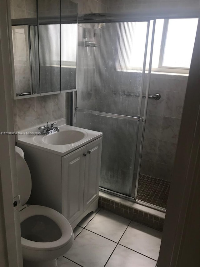 1221 W 62nd St, Hialeah, FL 33012 - full bath with toilet, a stall shower, vanity, and tile patterned floors