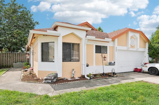 711 Holly St, North Lauderdale, FL 33068 - view of front of house featuring driveway, stucco siding, and fence