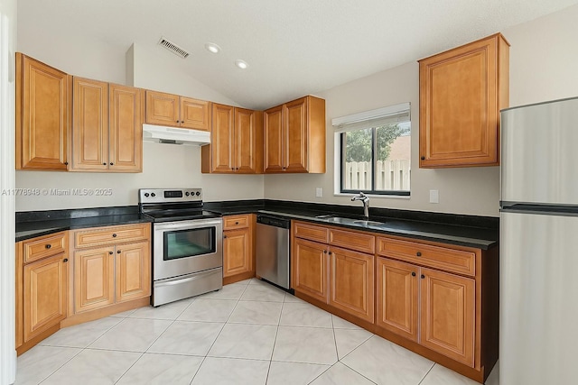 711 Holly St, North Lauderdale, FL 33068 - kitchen with visible vents, appliances with stainless steel finishes, under cabinet range hood, dark countertops, and a sink
