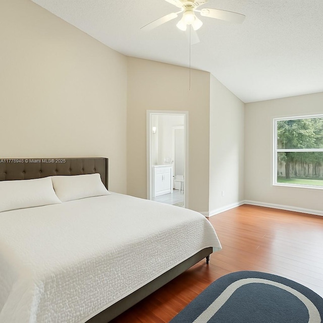 711 Holly St, North Lauderdale, FL 33068 - bedroom with ceiling fan, baseboards, vaulted ceiling, and wood finished floors