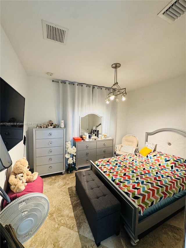 bedroom featuring visible vents