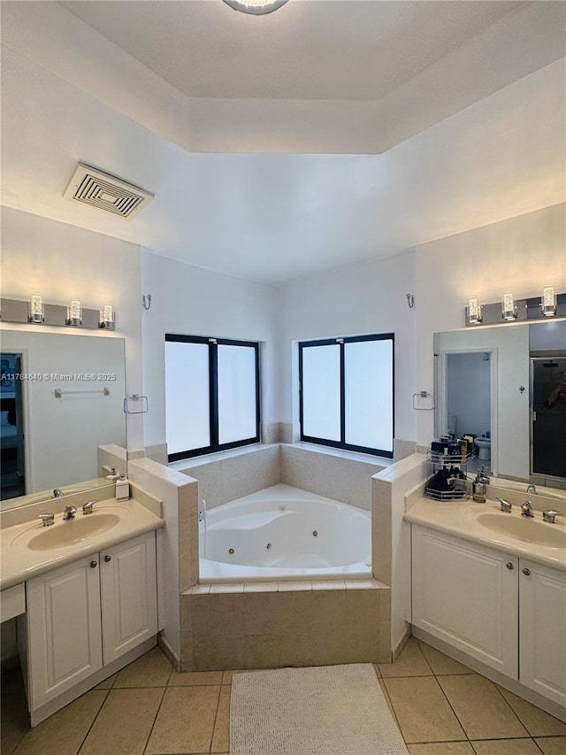 full bath featuring a sink, visible vents, and tile patterned floors