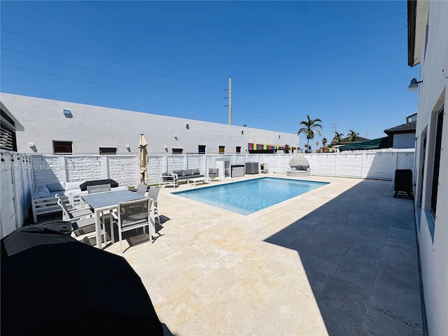 view of pool with a fenced backyard, a fenced in pool, a patio, and outdoor dining area