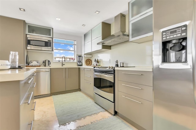 9250 W Bay Harbor Dr Unit 5C, Bay Harbor Islands, FL 33154 - kitchen with wall chimney range hood, light countertops, gray cabinetry, modern cabinets, and stainless steel appliances