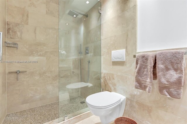 9250 W Bay Harbor Dr Unit 5C, Bay Harbor Islands, FL 33154 - bathroom featuring toilet, a walk in shower, and tile walls