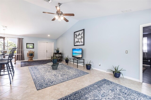 2661 SE 30th Ave, Naples, FL 34117 - tiled living room with visible vents, baseboards, a ceiling fan, and lofted ceiling