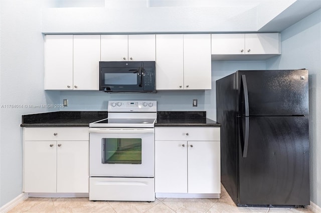 2661 SE 30th Ave, Naples, FL 34117 - kitchen with light tile patterned floors, white cabinets, black appliances, and baseboards