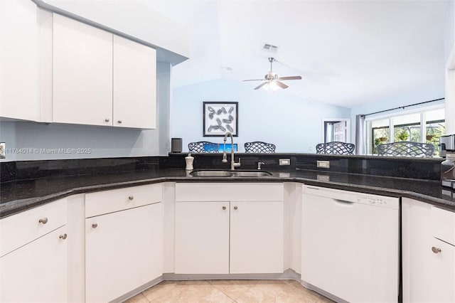 2661 SE 30th Ave, Naples, FL 34117 - kitchen with a ceiling fan, vaulted ceiling, dark stone countertops, a sink, and white dishwasher