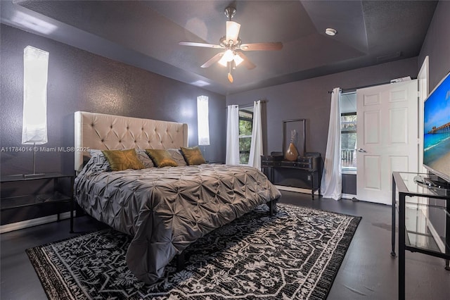 2661 SE 30th Ave, Naples, FL 34117 - bedroom with a tray ceiling, a textured wall, and a ceiling fan
