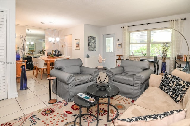 581 Blue Heron Dr Unit 112-B, Hallandale Beach, FL 33009 - living area featuring light tile patterned floors and an inviting chandelier