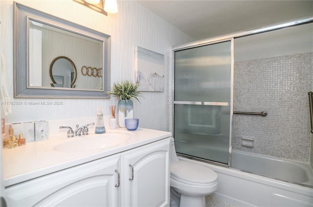 581 Blue Heron Dr Unit 112-B, Hallandale Beach, FL 33009 - bathroom with toilet, vanity, and combined bath / shower with glass door