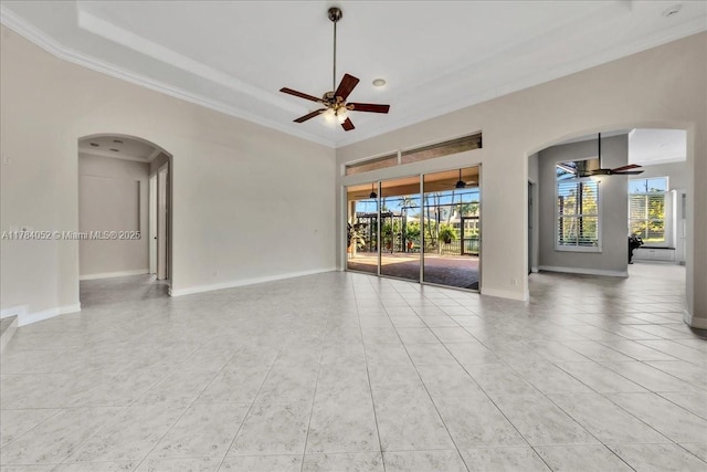 12580 NW 76th St, Parkland, FL 33076 - spare room with ceiling fan, arched walkways, ornamental molding, and light tile patterned floors