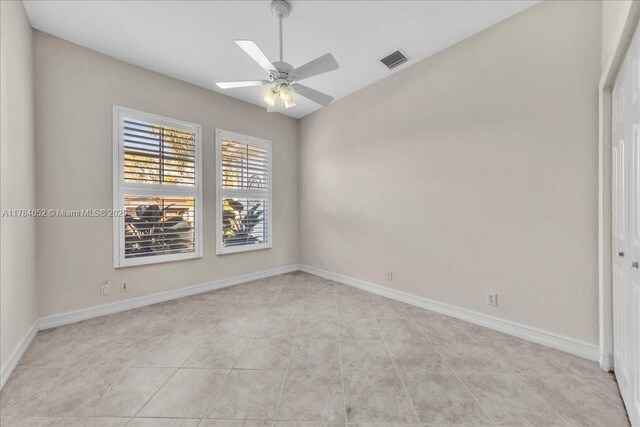 12580 NW 76th St, Parkland, FL 33076 - spare room with ceiling fan, baseboards, and light tile patterned floors