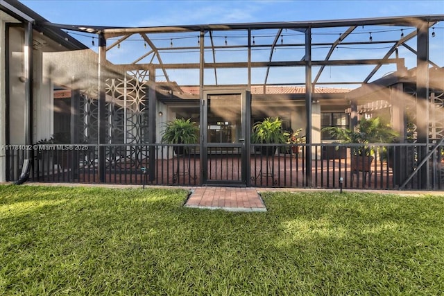 12580 NW 76th St, Parkland, FL 33076 - rear view of house featuring a patio area, a lawn, and glass enclosure